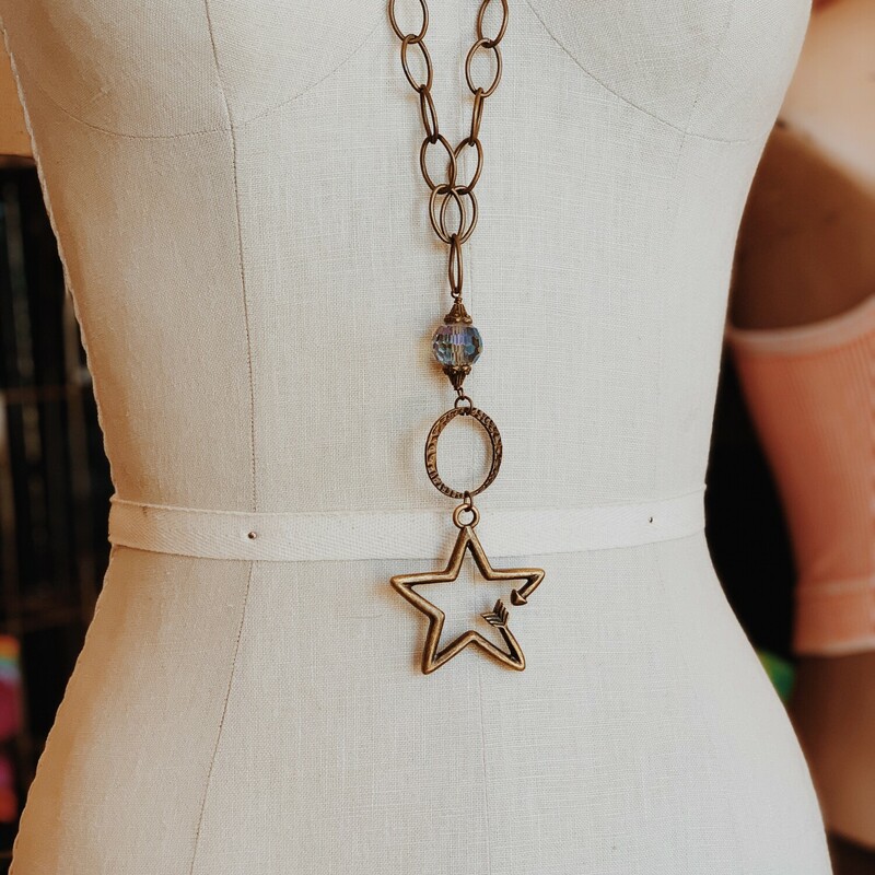 This handmade necklace is on a 32 inch chain made of multiple chain types! The pendant is a gorgeous arrow in the shape of a star!