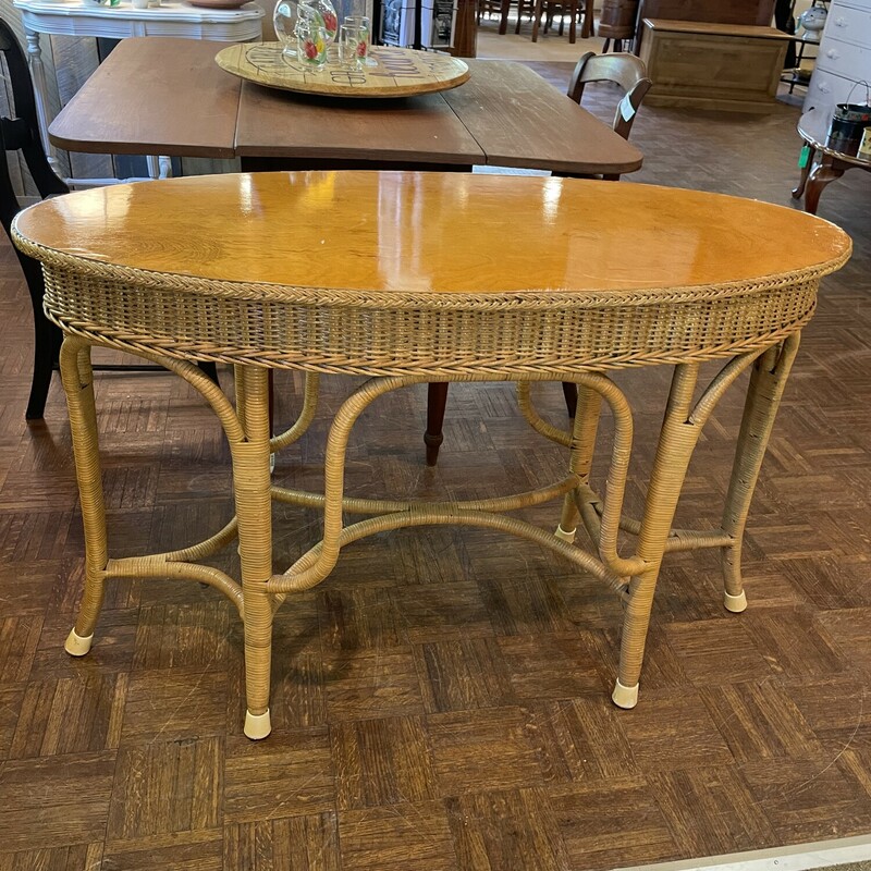 Oval Entryway Table
Size:  44 x 20 x 29
Beautiful wicker table with wooden top with beautiful grain.  What a statement in your entry!