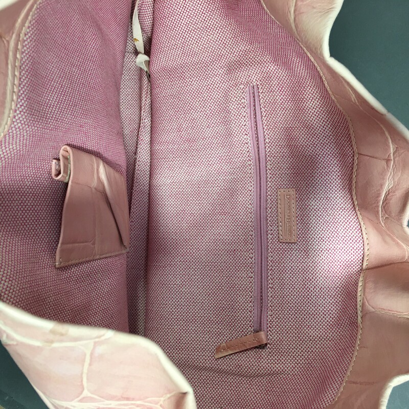 Dooney & Bourke, light pink/seashell color , Size: Medium<br />
<br />
Dooney and Bourke, pale pink/peach crocodile embossed leather, top handle, hobo style shoulder bag open top with a large chrome hardware closure over an exterior front pocket. Interior has zip pocket, and leather strip with latch.<br />
<br />
1 lb 9.3 oz