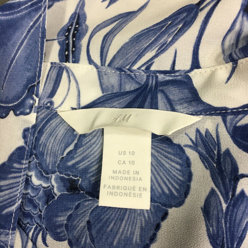 H&M Sleeveless Sheer, Floral, Size: 10 navy blue floral pattern, button up front, collar, 100% polyester.<br />
Made in Indonesia<br />
3.7 oz