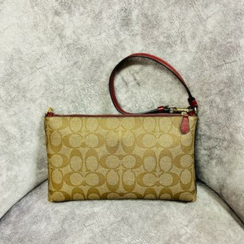 COACH<br />
LARGE WRISTLET 25 IN SIGNATURE CANVAS WITH GRAFFITI<br />
Signature coated canvas with smooth leather details<br />
Six credit card slots<br />
Inside zip and open pocket<br />
Zip-top closure, fabric lining<br />
Strap with clip to form a wrist strap or attach to the inside of a bag<br />
9 3/4\" (L) x 6\" (H) x 1 1/4\" (W)<br />
This bag is in like new condition<br />
A great affordable gift or just a fun wristlet to add to your collection.<br />
TOO CUTE TO PASS UP!