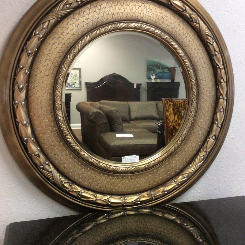 This mirror is meant to impress. It has a oversized carved wood frame with a gold gilt finish. Will make a statement in any room.