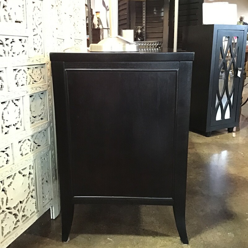 A modern classic, this Arhaus chests understated aesthetic features sleek silhouettes defined by clean lines and deep black  finish. Subtle nickel hardware elevates the style by complementing its black finish with sophisticated detailing.  This piece has a pull out shelf that can be used to write on or as a spot by your bed to put a drink.  There is a drawer and a deep space below to hold so many different things!<br />
<br />
Dimensions:  38 x 19.5 x 29.5