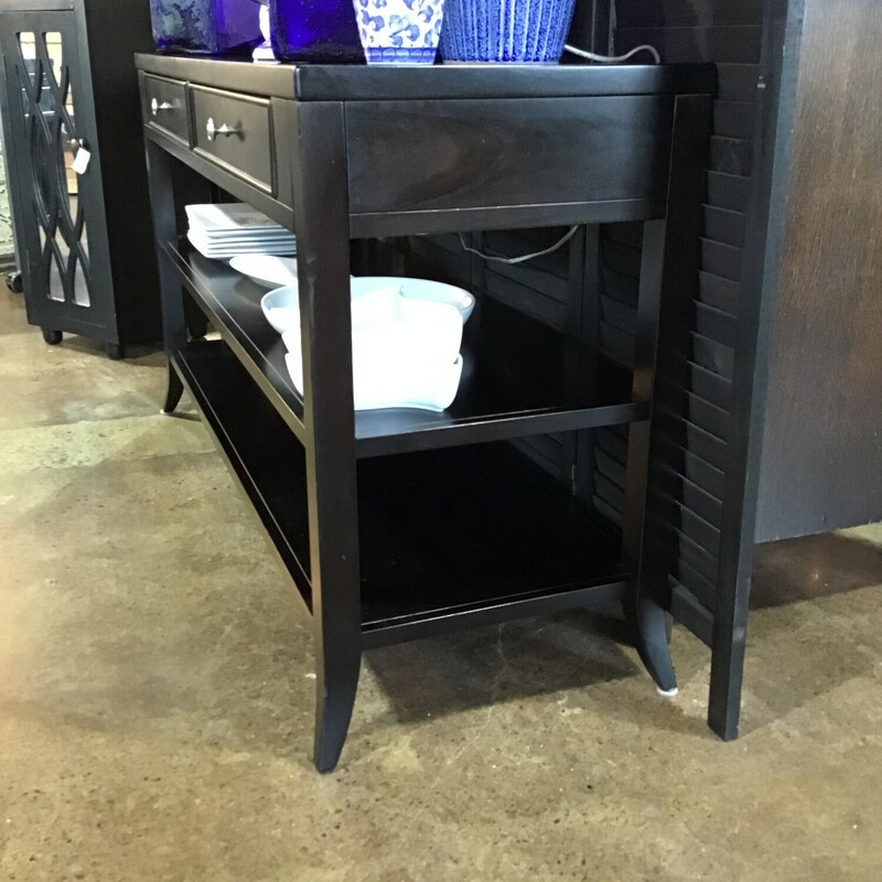 This is one of those pieces that can be used in so many different ways, that it is hard to pick what category to put it in.  Made by Arhaus.  Featuring two drawers accented with nickel knobs and two lower shelves, all finished in black.  This could be a media stand, a buffet, an entryway table or a sofa table!<br />
<br />
Dimensions:  54x18x30