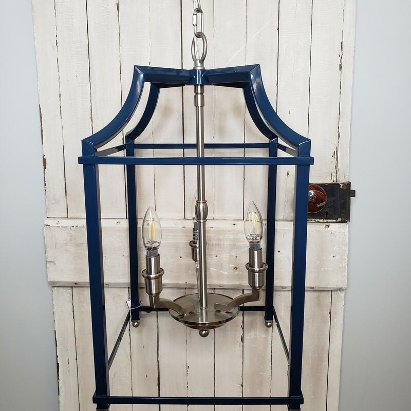 Hanging lighting fixture with three candelabra bulbs. Blue metal with silver chain. Size: 22x12x12.