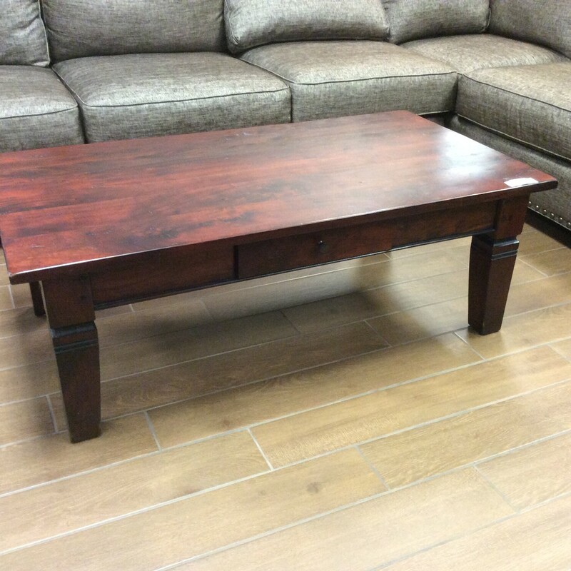 This beautiful Dark Red Wood finish Coffee Table features 1 pull out drawer and amazing detail on the legs. This Coffee Table is very sturdy.