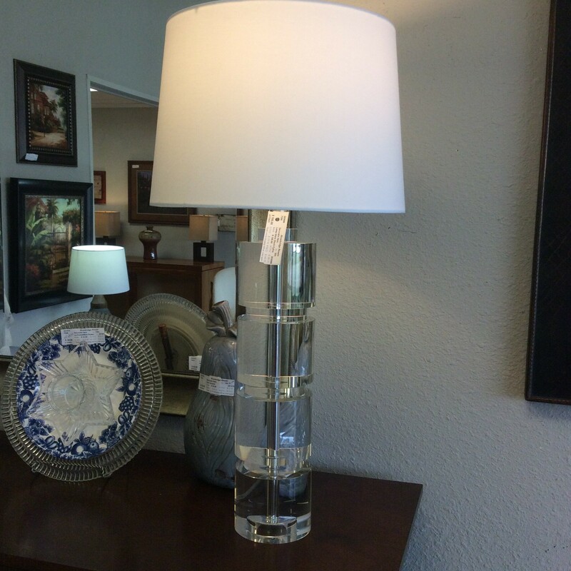 This is a Stacked Cylinder Glass Lamp with a beautiful White Shade that helps reallly brighten up a room.