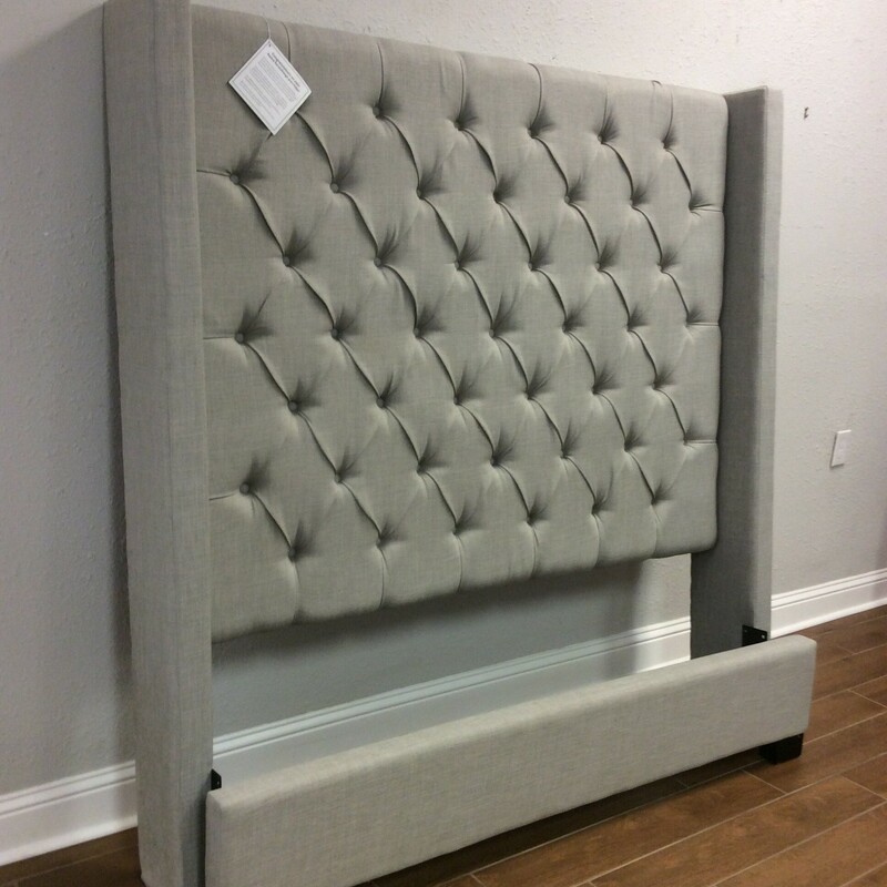 This is a Light Grey Queen Upholsterd Button Back Headboard and Footboard. This Headboard comes with rails and is made by Standard Furniture IFM.