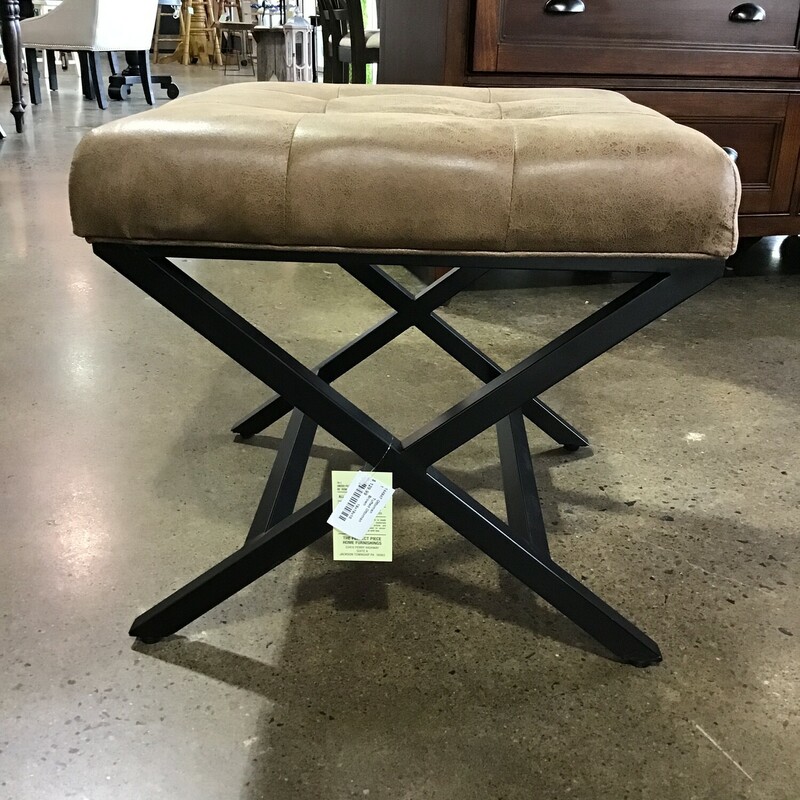Brown faux leather upholstery and metal base ensure durability.  Tufted detailing creates a visual appeal<br />
Ottoman can serve as a footrest, makeup stool, or an accent piece!  Buy them both and push together as a coffee table!<br />
<br />
Matches #144946<br />
<br />
Dimensions:  19x19x18