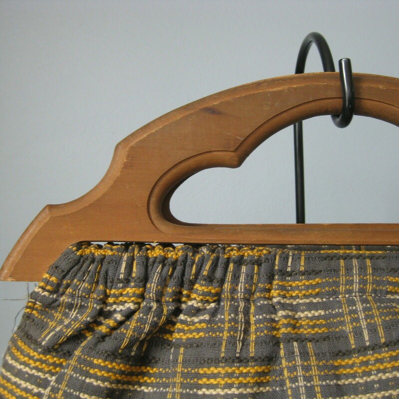 Vintage knitting bag with wooden handles.<br />
It's made of gray fabric embroidered with white and yellow.<br />
Opens wide with no closures.<br />
beige fabric lining<br />
The hem on the edge at one side of the opening is a little frayed as shown.  (I'll stitch them down before I ship!)<br />
<br />
<br />
I like it as a either a handbag or a knitting or craft bag<br />
<br />
Measurements<br />
Width: 15.5<br />
Height: 12<br />
it's flat but quite expandable<br />
<br />
Thank you for looking!<br />
#47933