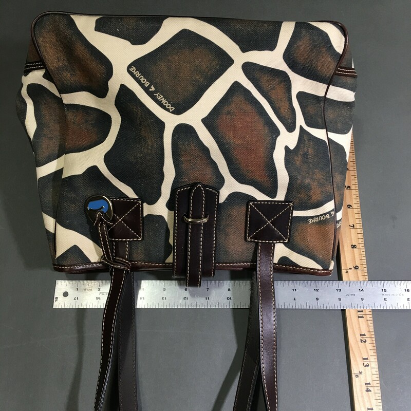Dooney & Bourke Giraffe, Pattern, Size: Large
Condition:	Pre-owned

12 in x 10 in x 6 in

Exterior Material: Canvas & Leather
Black  cream and brown,  Lightweight Shoulder Bag
 with Dooney & Bourke signature metal bag charm.
Dark brown leather strap and gold hardware, (5) grommets on bottom on bag, pink canvas interior wth zip wallet pocket and separate phone pocket

1 lb 1.5 oz