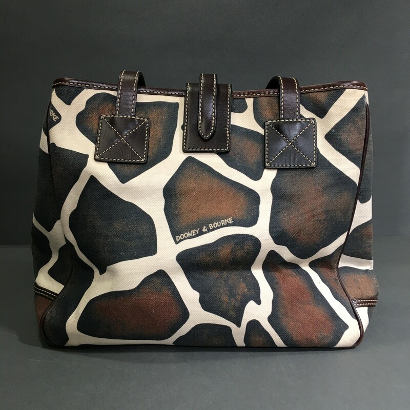 Dooney & Bourke Giraffe, Pattern, Size: Large
Condition:	Pre-owned

12 in x 10 in x 6 in

Exterior Material: Canvas & Leather
Black  cream and brown,  Lightweight Shoulder Bag
 with Dooney & Bourke signature metal bag charm.
Dark brown leather strap and gold hardware, (5) grommets on bottom on bag, pink canvas interior wth zip wallet pocket and separate phone pocket

1 lb 1.5 oz