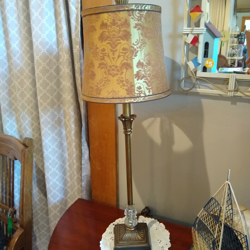 Antique Style Gold Lamp

Antique looking gold lamp with a fabric shade.

Size: 26 inches high