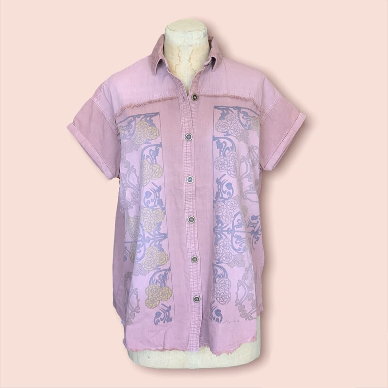 This gorgeous mauve shirt is madeof a denim material and has a lovely floral pattern on the front!