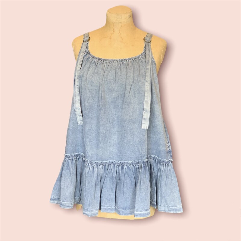 This denim babydoll tank is perfect for summer! It is made of a light, breathable denim and has accommodating, adjustable straps!