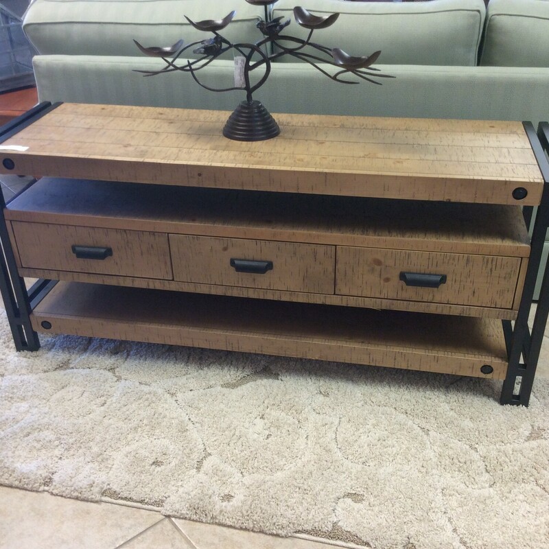 This is a Distressed Wood TV Table. This TV Table has Black Iron Legs, 3 Drawes and 3 Shelfs for plenty of storage.