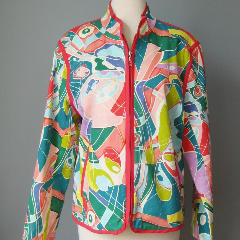 High quality cotton cropped blazer from the 1990s by Redd Jeans
It's made of polished cotton and sports the wildest abstract print in tones or pink, peach teal, white and yellow.
Clear sequins sprinkled about for a subtle bit of glimmer.
Zippered front and pockets with cool little plastic pulls
Red contrast trim keeps the design grounded.
Very nicely tailored and fully lined. most glowing jewel tone sun god print in a geometric pattern.
97% cotton, 2% spandex

Marked size 14 (pls see measurements!)

flat measurements:
shoulder to shoulder: 16.5
armpit to armpit: 22
width at hem: 21.5
length: 24
underarm sleeve seam: 17.5

perfect condition.
thanks for looking!
#47004