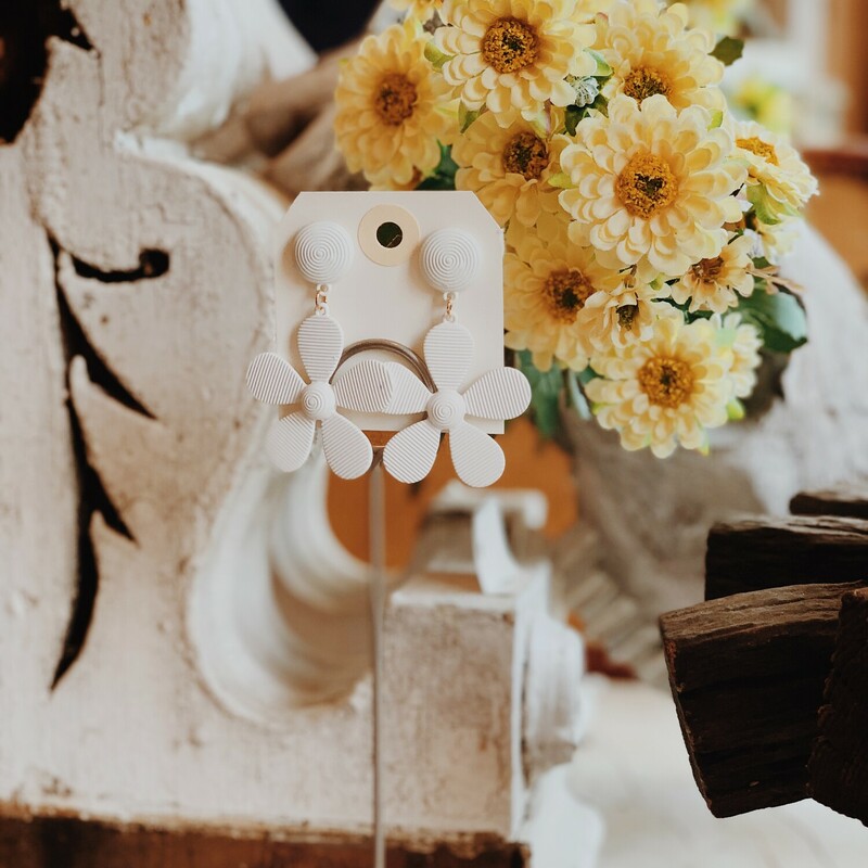 These adorable white daisy earrings measure 2.5 inches in length!