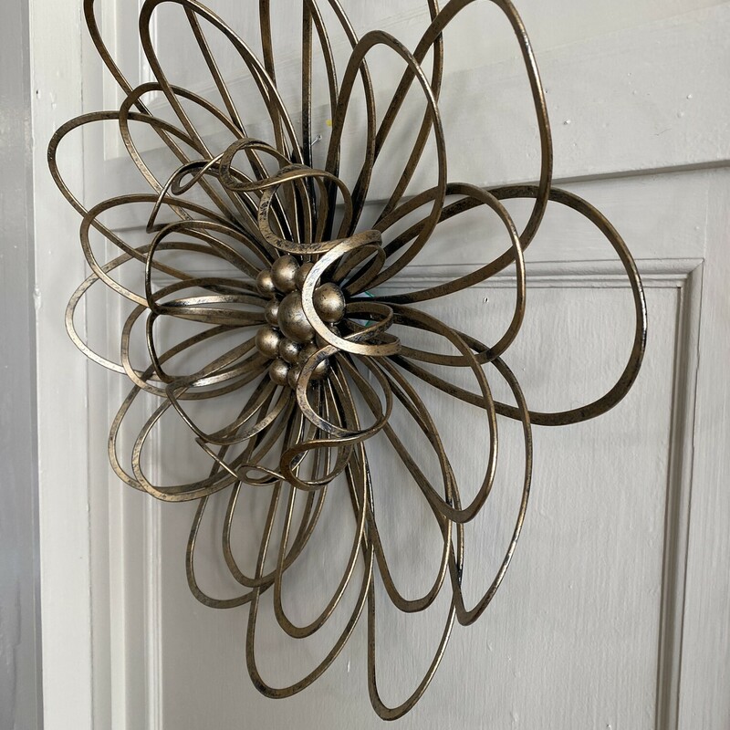 Metal Flower Wall Art<br />
19 1/2 inches across<br />
Hammered/ Brush gold look