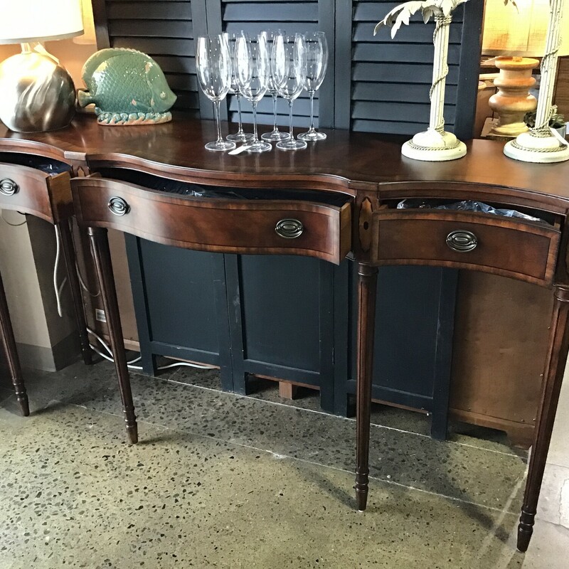 High Quality American Made

Inlaid Serpentine Console/Buffet with three drawers, including Felt-Lined Silverware Drawer and 2 felt lined drawers that can me removed (they are still in the original plastic.

Dimensions: 70x17x39.5
