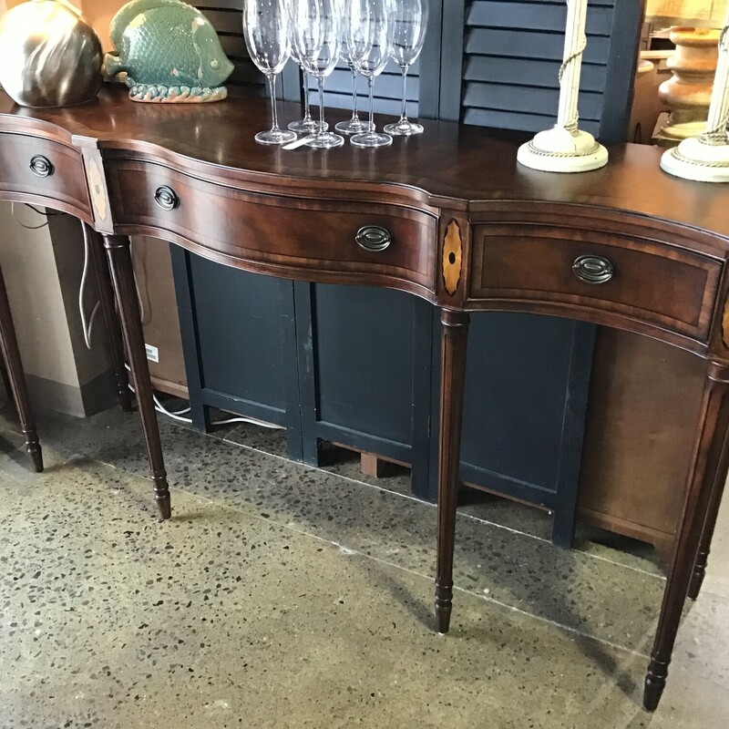High Quality American Made

Inlaid Serpentine Console/Buffet with three drawers, including Felt-Lined Silverware Drawer and 2 felt lined drawers that can me removed (they are still in the original plastic.

Dimensions: 70x17x39.5