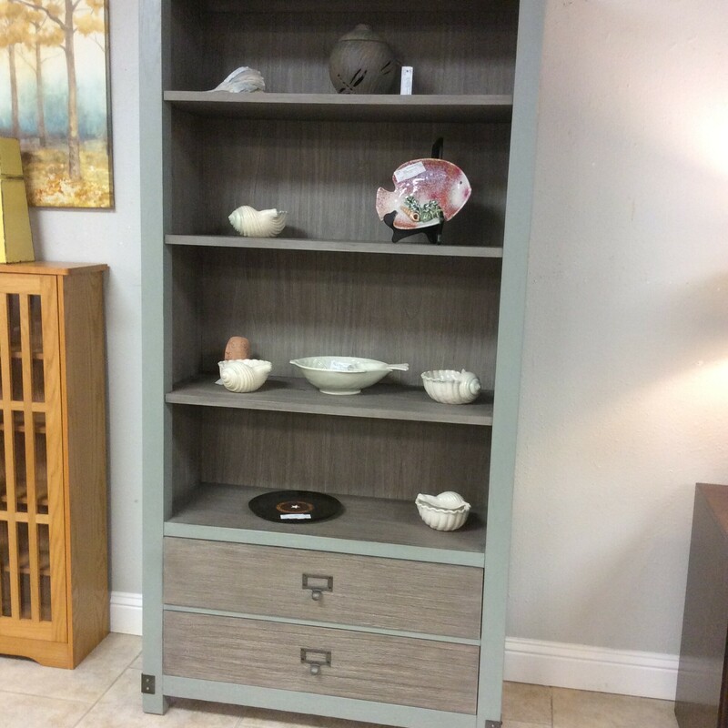 This is a Beautiful ARHAUS Weathered Gray & Dusty Blue Bookcase. This bookcase has 2 Drawers that have File Cabinet Knobs and 3 Adjustable Wood Shelfs.