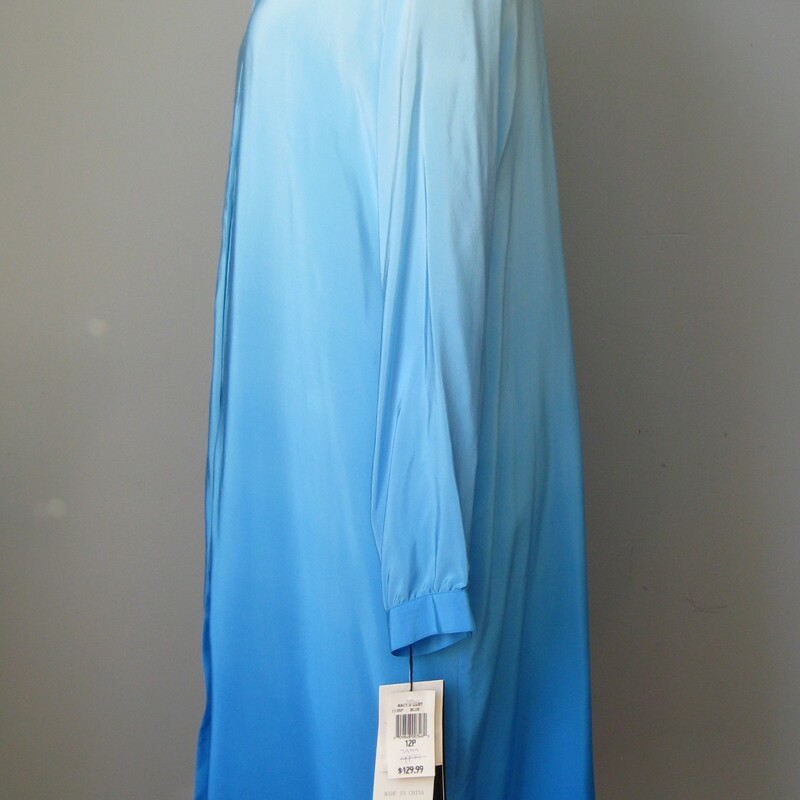 Deadstock piece from Bob Mackie<br />
Heavenly Ombre Blue silk shirt dress or duster<br />
long button sleeves<br />
fully lined<br />
soft shoulder pads set with snaps, removing these will not ruin the line of the garment, as it was designed to be worn either way.<br />
<br />
Marked size 12 P<br />
Flat measurements:<br />
Shoulder to shoulder: 16<br />
Armpit to Armpit: 22<br />
Waist: 20.5<br />
Hip: 22.5<br />
underarm sleeve seam: 17.5<br />
Length: 38<br />
<br />
Excellent condition, no flaws!<br />
thanks for looking!<br />
#42883
