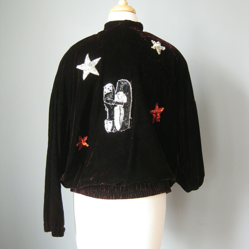This is a deep deep almost black burgundy velvet warmup jacket upcycled by its former owner with sequined stars and tap shoes on the back.<br />
Sturdy metal zipper<br />
pockets<br />
by Concepts<br />
excellent condition<br />
<br />
Flat Measurements:<br />
Shoulder to Shoulder: 18<br />
Armpit to Armpit: 22.5<br />
Length: 28<br />
Underarm sleeve seam: 16.5<br />
<br />
excellent condition!<br />
<br />
Thanks for looking!<br />
#43215