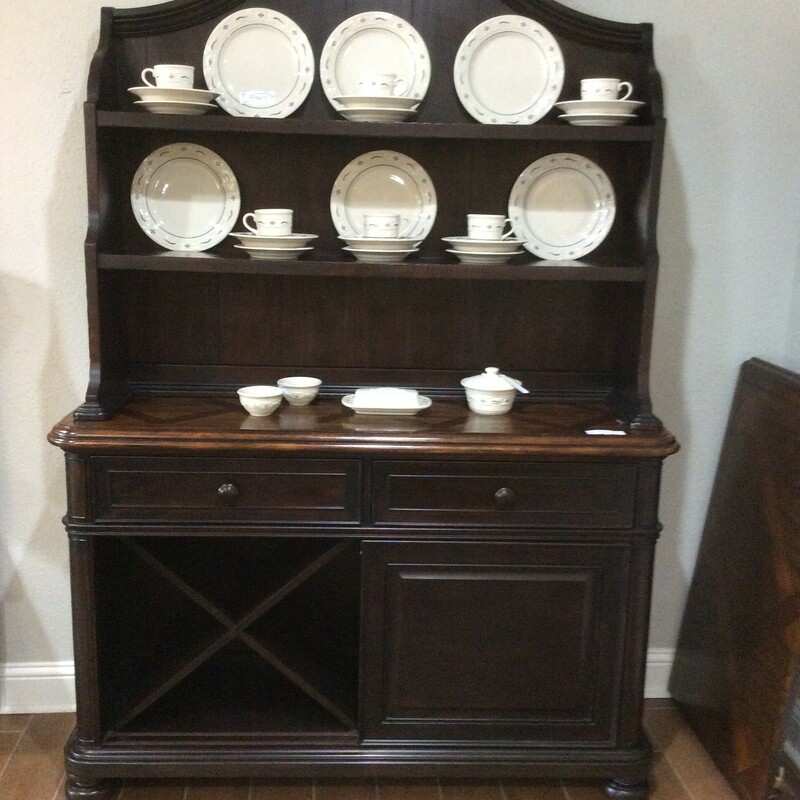 This is a Legacy Classic Furniture Dark Brown with Diamond Pattern Hutch. The Top Piece has 2 Shelfs. The Bottom Cabinet has 2 Drawers, Double Sliding Doors with a Wine Wrack and 2 Adjustable Shelfs.