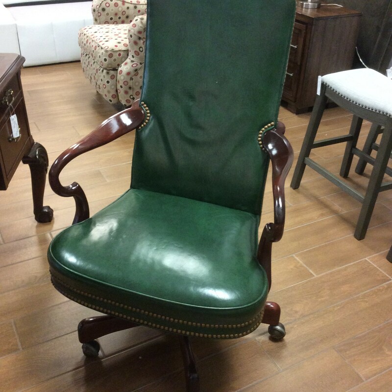 This is a Green Leather St. James, Hickory Chair. This is a Rolling/Swivel Chair. This Chair also has Mahogany Stained Arms & Legs and Nailhead Trim.