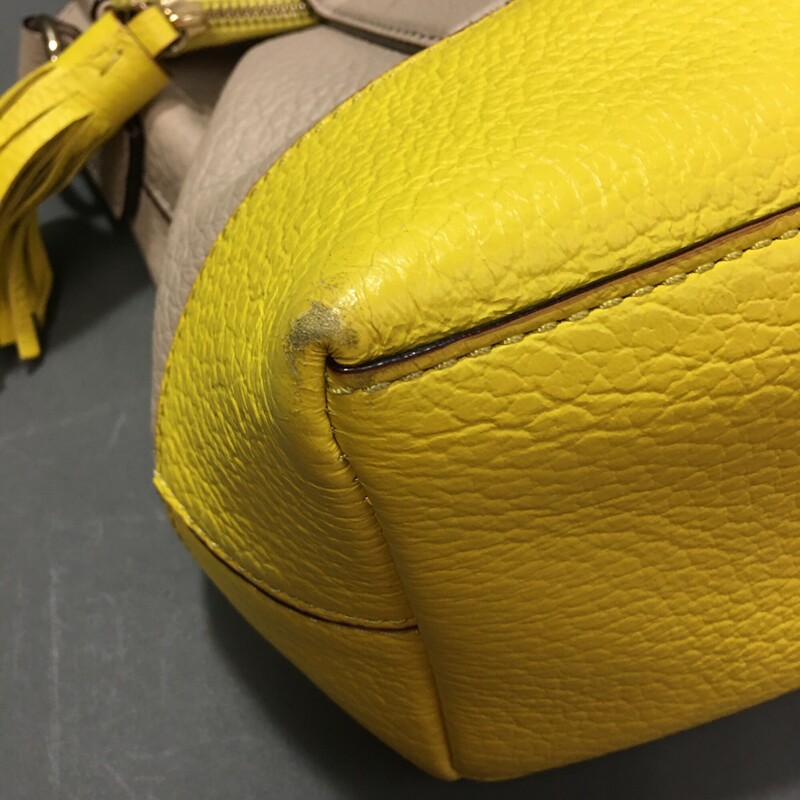 Kate Spade Southport Avenue Carmen, 2 tone Lemon Yellow and Sand pebble embossed cowhide leather satchel.<br />
All zippers working, features 14-karat light gold plated hardware and custom woven book black and white stripe lining.<br />
One inner zip with two pouch pockets, a larger zip pocket in fold over section. Tassel detail on zipper, magnetic closer, removable and adjustable crossbody strap, satchel handles.Sold with 2 tone shoulder strap and includes a Kate Spade dust bag. It measures 10''h x 15''w x 5''h with handle drop length of 5.5'' and a 16.5'' strap. This bag has some gentle wear ont he base corners where leather has worn.  A great bag!<br />
<br />
2 lbs 3.2 oz