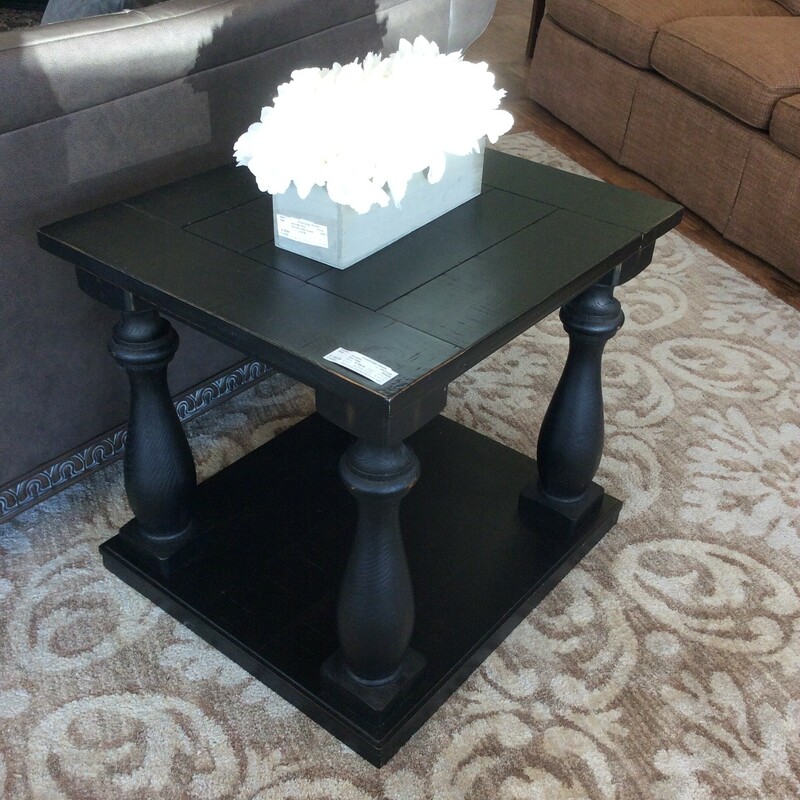This is a Ashely Furniture Black Rustic  End Table. This End Table has beautiful disstressed Plank Wood Finish and Vase and Block Style Legs.