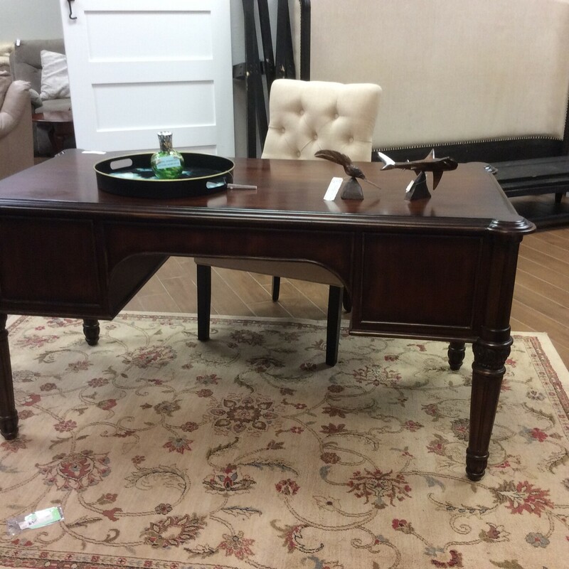 This is a Dark Stain Ethan Allen Executive Desk. This Desk feautures a File Drawer, and Keyboard Drawer and 2 Standard Size Drawers.