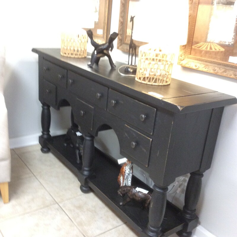 This is a Attic Heirlooms Broyhill Buffet Table. This Buffet is a Solid Oak Distressed Black with 6 Drawers and Vase and Block Legs.