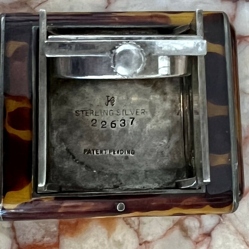 Tavannes Bag Shutter Watch, Sterling Silver & tortoise shell with arabic numerals c.1920-30s. Watch is a working Swiss Tavannes in an American  Kreisler NY case with original pouch. It works by squeezing both sides to release watch. Place to monogram untouched. A rare piece for any watch collector.