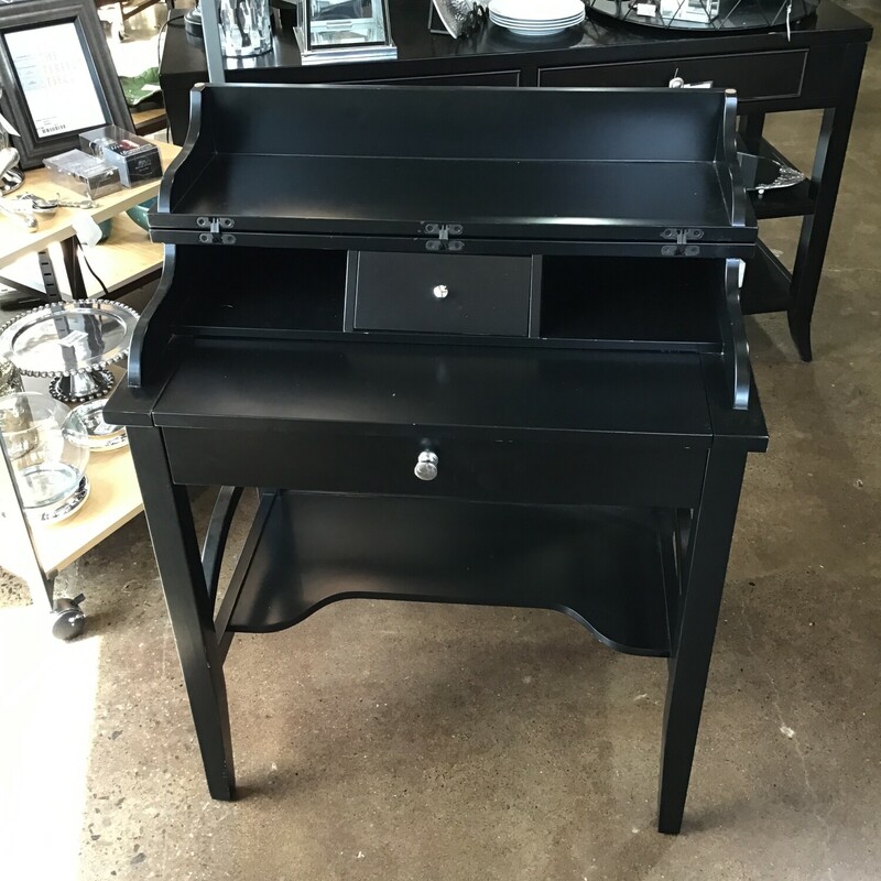 From its fold-down top to its bottom drawer and top drawer and cubbies, this black is built for convenience and organization. It's also built to last,

Dimensions: 28x18x32