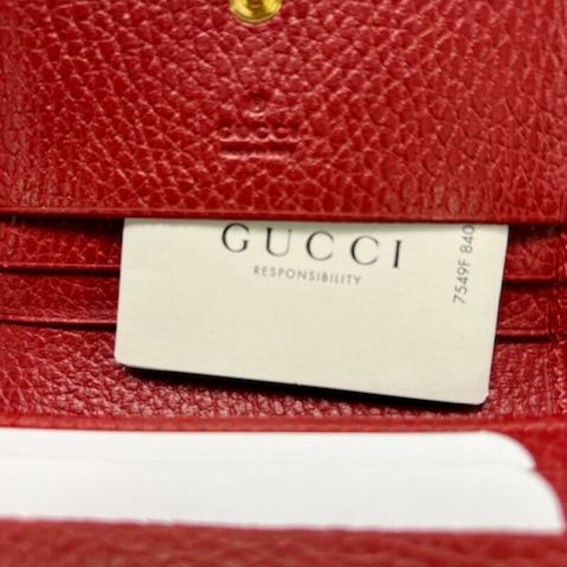 GUCCI<br />
NET SUSTAIN Marmont Petite textured-leather wallet<br />
Gucci's wallet is part of the label's coveted 'Marmont' family - the overlapping gold monogram on the front is a dead giveaway. Made in Italy from chrome-free tanned textured-leather, it opens to five card slots and a zipped pocket for coins.<br />
This product was created using Considered Processes, which is Net Sustain - the opportunity to invest in sustainable luxury.<br />
Style ?456126 CAO0G 6433<br />
A card case wallet with small Double G metal detail. Made in textured leather.<br />
DETAILS:<br />
-Hibiscus red metal-free tanned leather<br />
-Gold-toned hardware<br />
-Double G<br />
-Five card slots<br />
-One bill compartment<br />
-Interior zipper pocket<br />
-Snap closure<br />
-Open: W11cm x H17.5cm<br />
-Closed: 4.3\"W x 3.3\"H x 1.2\"D<br />
-Made in Italy<br />
The Original Retail price on this wallet is $460.00 avaiable online with GUCCI NOW!<br />
The Wallet does come with the Original Dust cover and GUCCI box.<br />
The wallet is in excellent condition, No flaws found on the leather, very well cared for.  Only the GUCCI gold in te front shows signs of wear.<br />
TheRealReal has this wallet for resale without the box & bag for $325.00