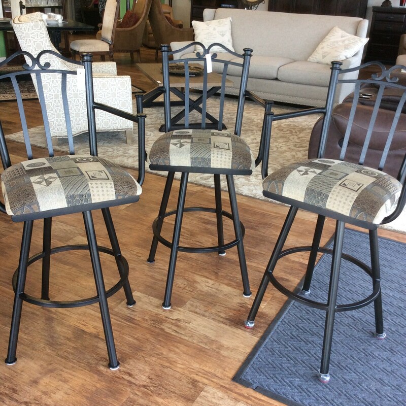This set of 3 Swivel BarStools have heavy duty black metal frames with upholstered seats.