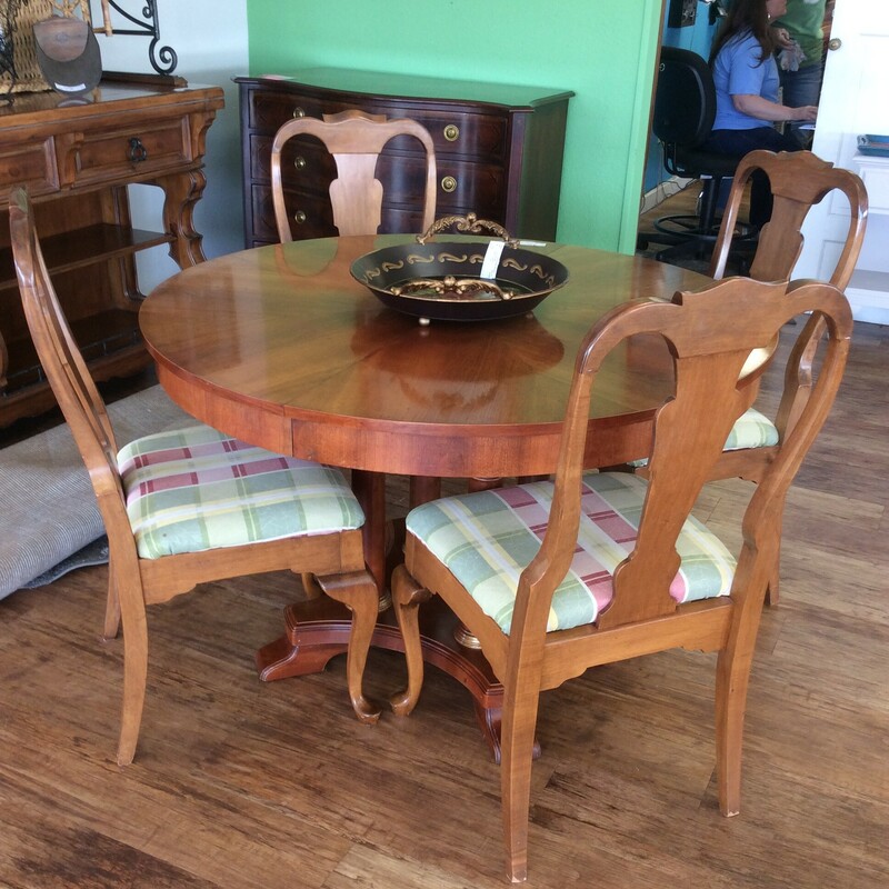 This charming table and 4 Chairs has a light cherry finish and beautifuly veneered top.