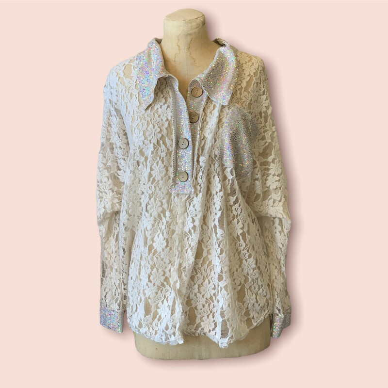 This absolutely fabulous top is as fun as it gets! With a sequin collar and lace for the rest of the shirt, this piece is sure to make an amazing fit!