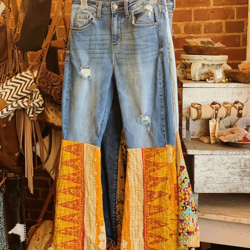 These rockin kantha flare jeans are handmade and absolutely gorgeous! This one of a kind pair is a 28 inch waist with the waist measuring 14 across when laying flat.