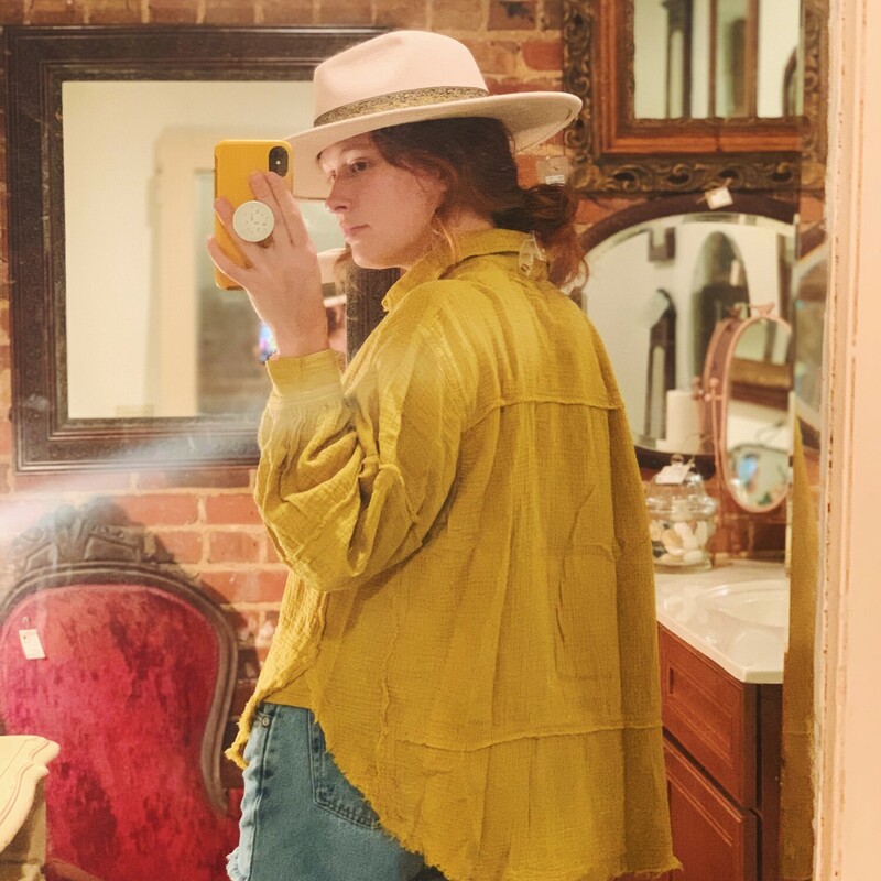 These gorgeous tops come in a rich mustard color and are made of the very popular gauze material with frayed hems! This is a staple piece!