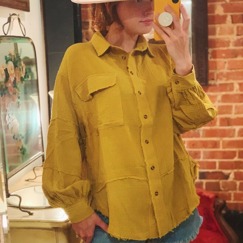 These gorgeous tops come in a rich mustard color and are made of the very popular gauze material with frayed hems! This is a staple piece!