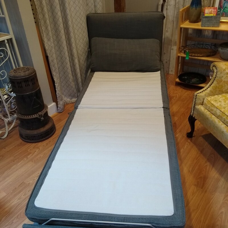 IKEA Blue/Grey ChaiseBed<br />
<br />
Like new IKEA chaise which opens to a bed.  Fabric is a blue grey color and is excellent condition. The bottom of the chaise slides out and the cushion upzips to lay flat as a mattreess.  The back is adjustable and can be moved to fit any of the 3 sides of the chair.  Very nice piece!<br />
<br />
Closed Size: 44 in deep X 32 in wide X 33 in high at back of chair.<br />
Open Size: 83 in deep X 32 in wide X 33 in high at back of chair