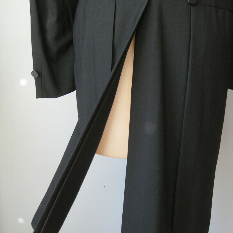 How dashing - How HANDSOME will you be in this really formal gorgeous black wool long tuxedo jacket<br />
I have two of these, one is 42 Short and the other is 40L<br />
Satin lapels<br />
Made in the USA<br />
Like new condition<br />
<br />
42 Short Flat measurements:<br />
Shoulder to shoulder: 17.5<br />
ampit to armpit: 20.5<br />
waist: 20<br />
underam sleeve seam length: 15.5<br />
length in front: 19<br />
length in back: 38<br />
<br />
I have this exact same coat in 40L, pls search my shop for tailcoat<br />
<br />
Thanks for looking!<br />
#42885 (42 short)