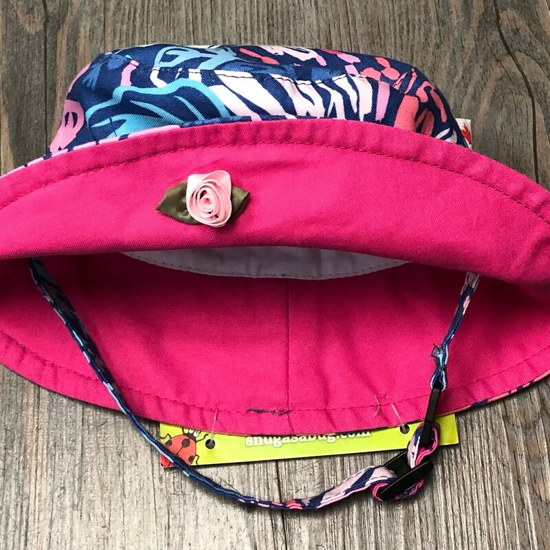 Tropical Breeze Sun Hat, Pink/Blue, Size: 6-12M<br />
NEW!<br />
Sized to Child's Age - for a perfect fit<br />
Cotton Liner - on the inner part of the hat for added sun protection<br />
Chinstrap - it’s fully adjustable and keeps the hat in place with a break away clip for safety<br />
100% cotton - means it’s lightweight, soft and breathable<br />
Machine Washable - durable and easy to love<br />
Made In Canada