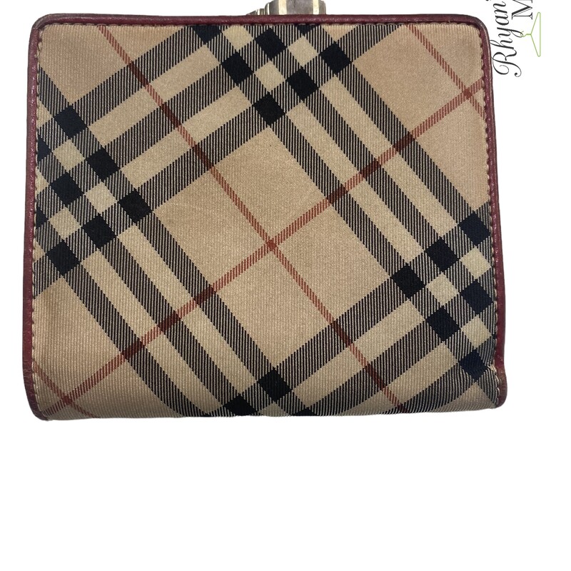 Burberry wallet<br />
red leather interior<br />
clean no cracking<br />
minor wear on outside<br />
vintage piece
