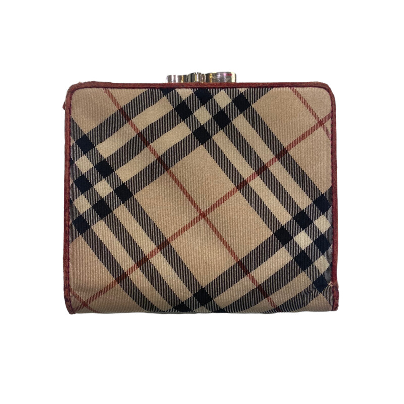 Burberry wallet<br />
some minor scratches on inside<br />
red leather interior<br />
everyday wear on outside<br />
vintage piece
