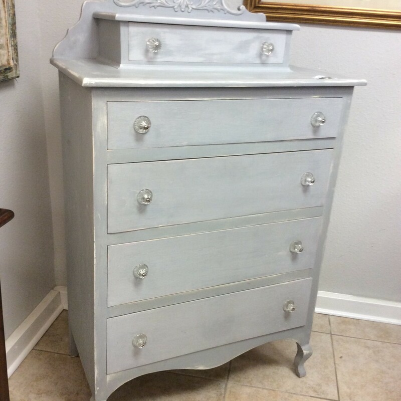 This Shabby Chic dresser has a grey chalk paint finish and glass pulls.