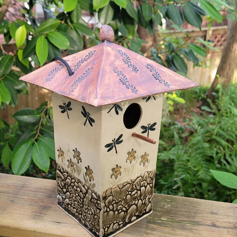 Lily & Dragonfly Birdhouse
Artist:  Pam Gray
Medium:  Pottery
Dimensions:  11 in x 4- 1/2 x 4-1/2
Description:  Ceramic Birdhouse with daylily and dragonfly design.  This birdhouse was designed using Audobon Sociey specifications for chickadees, wrens and other small birds.  The roof lifts off for easy cleaning.